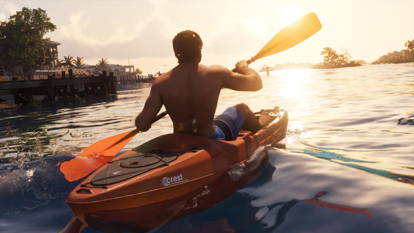 A paddler in a red-orange kayak holding a double-bladed paddle near shore